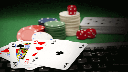 keyboard with casino poker cards and chips